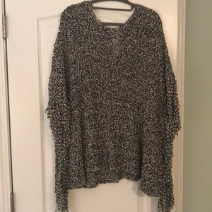 One size fits all, black and white fringe poncho
